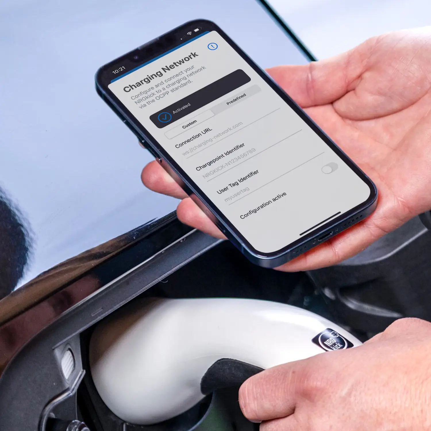 Electric car charges on intelligent NRGkick wallbox, app shows OCPP function.
